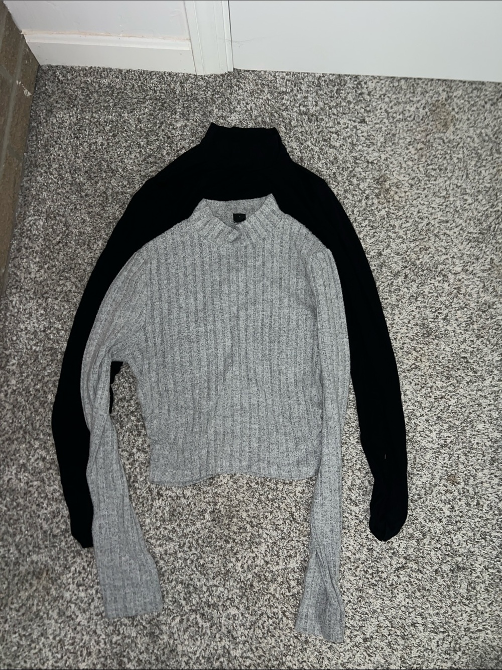 Crewneck Ribbed Sweater in Light Gray and a black long sleeve turtleneck